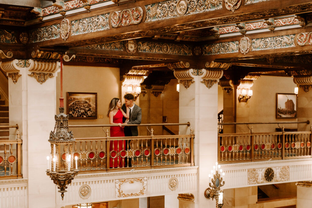 couple standing on balcony in davenport hotel lobby