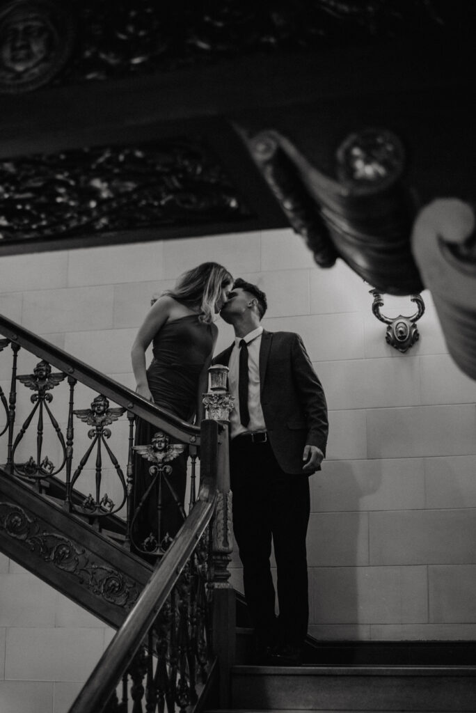 couple standing on stairs in davenport hotel lobby