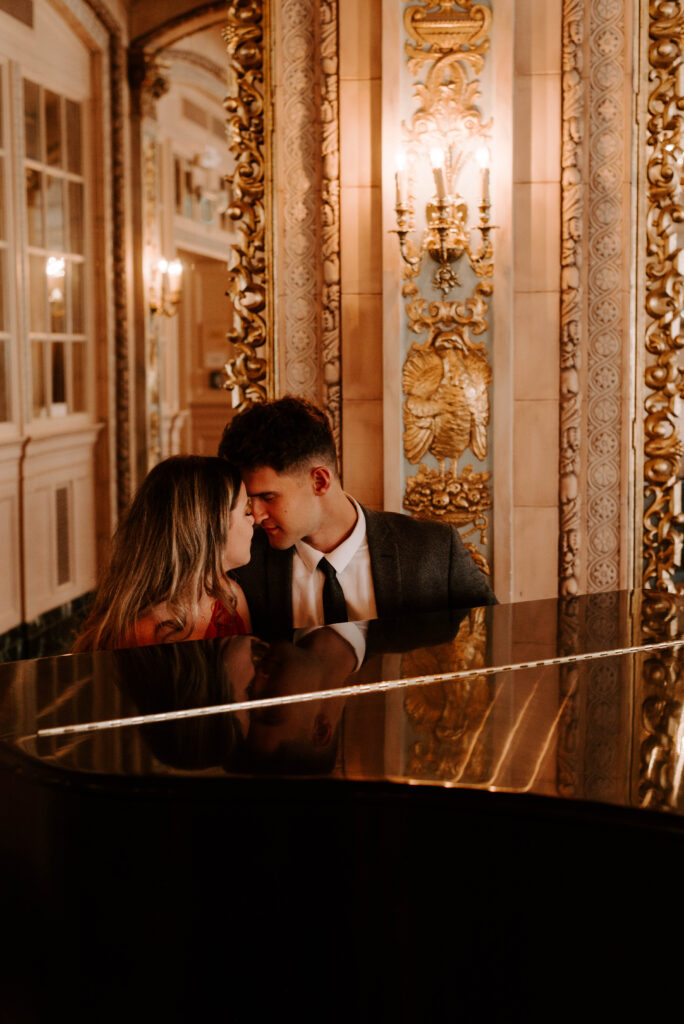 couple sitting at piano in isabella ballroom