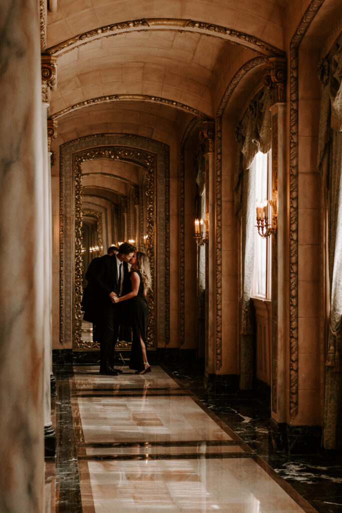 couple kissing in front of mirror in isabella room