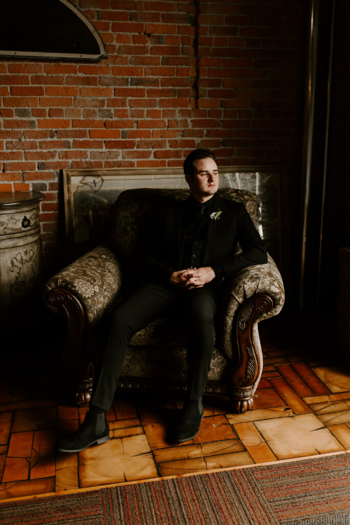 Portrait of the groom in a chair