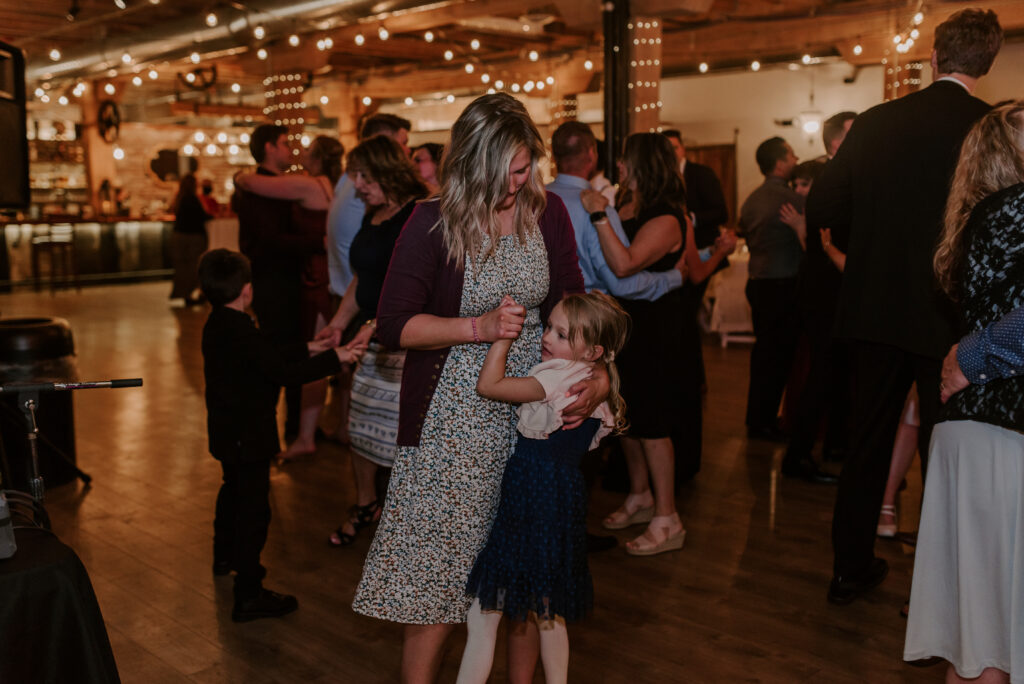 mother and daughter dancing at the wedding reception