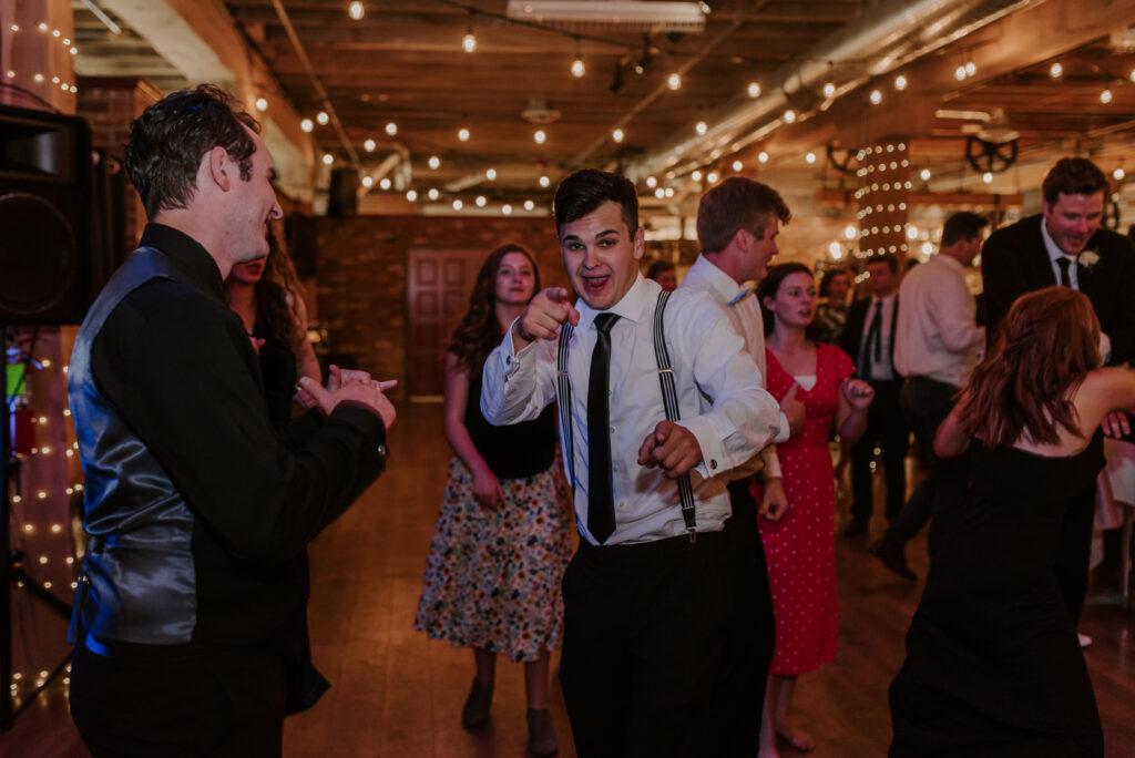 groom dancing with a groomsman