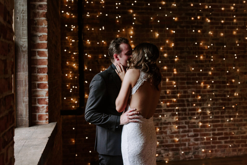 Bride and groom kissing during their first look. 