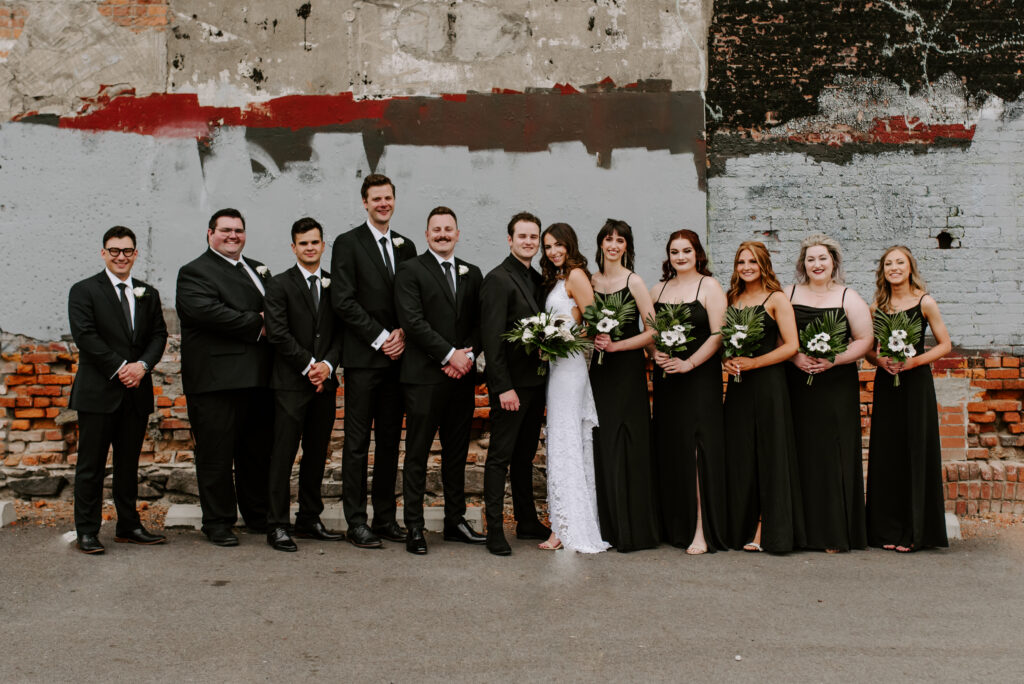 Wedding party portrait in the parking lot of The Boxcar Room