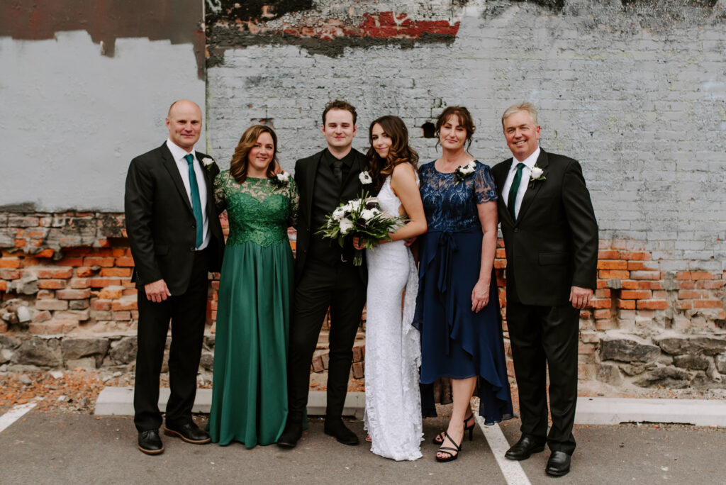 Bride and groom with both sets of their parents
