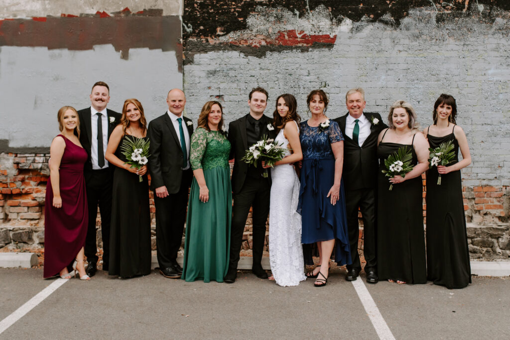 Bride and groom with both of their families