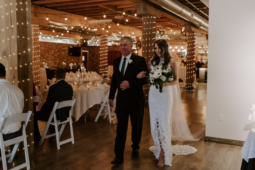 Bride walking down the aisle with her dad at The Boxcar Room