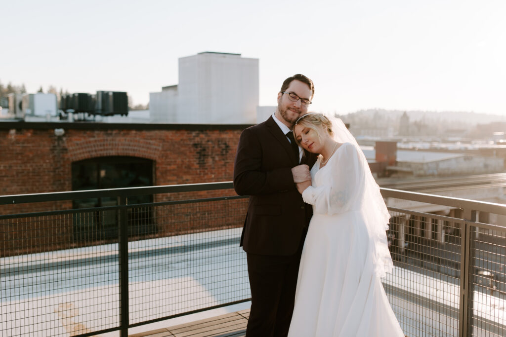 bride and groom duing golden hour on montvale event center rooftop