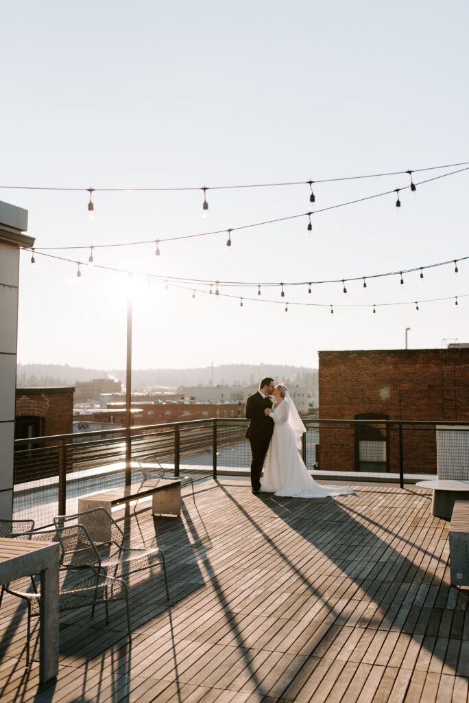 bride and groom duing golden hour on montvale event center rooftop