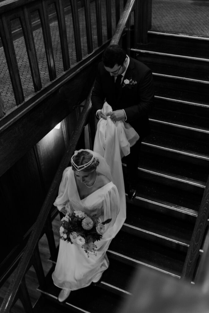 bride and groom walking down stairs at Montvale Event Center