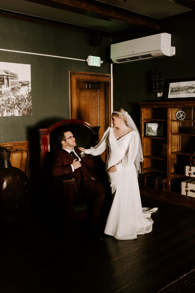 bride and groom sitting on chair together