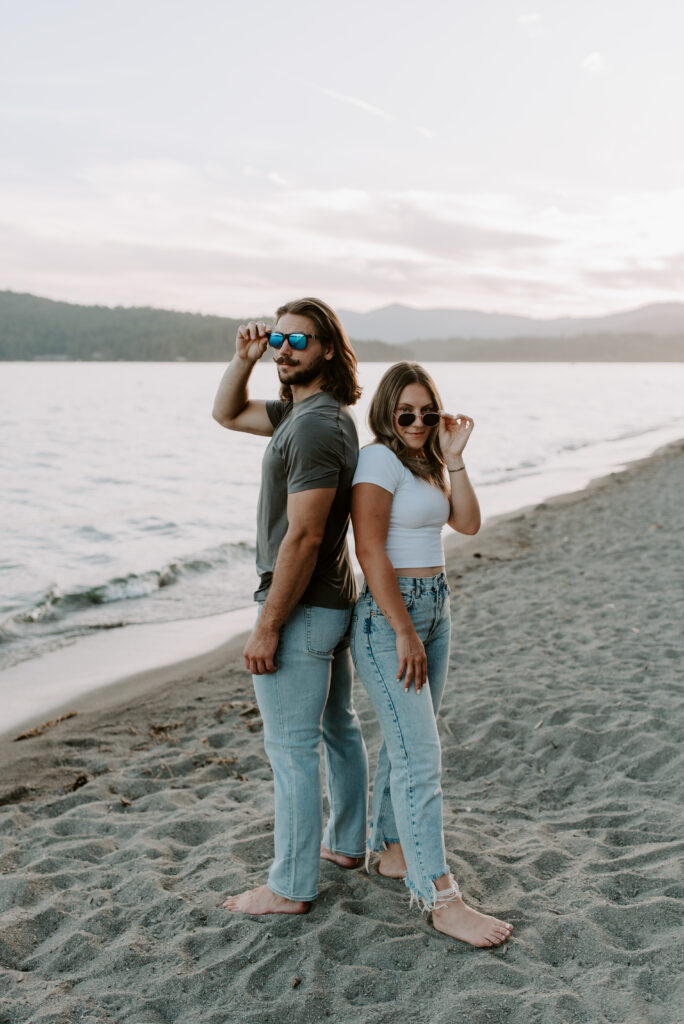 Couple with sunglasses on the beach at Lake Coeur D'Alene