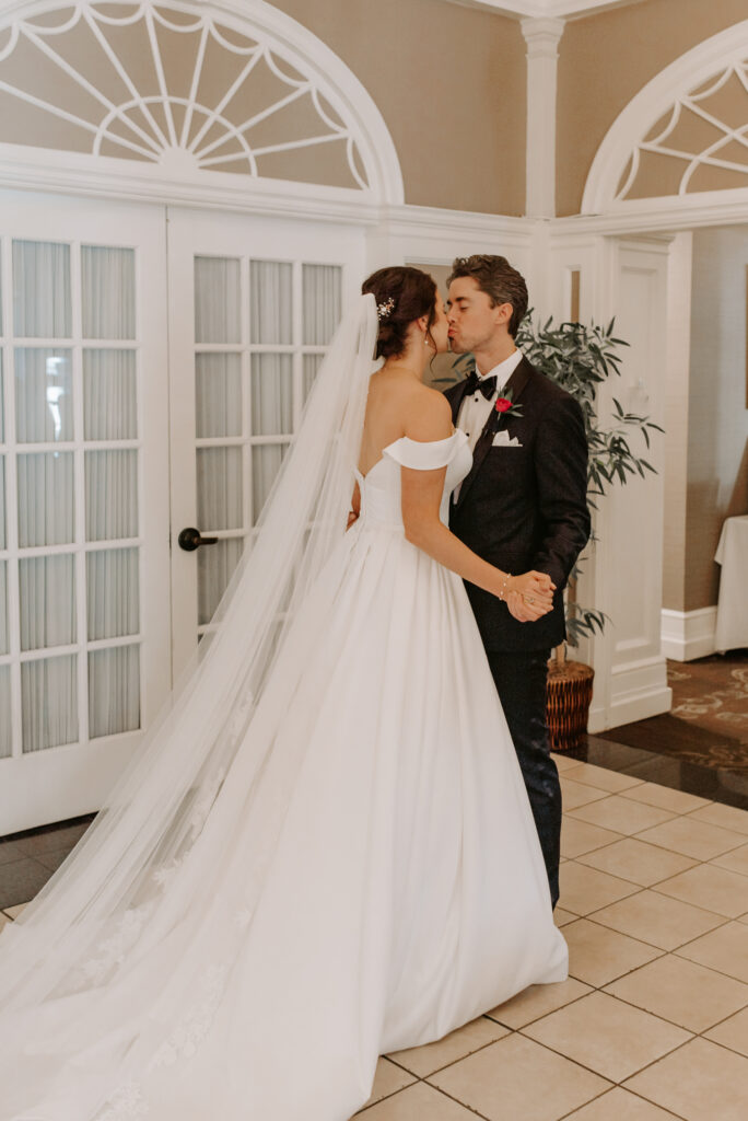 Bride and Groom share a kiss during the first look