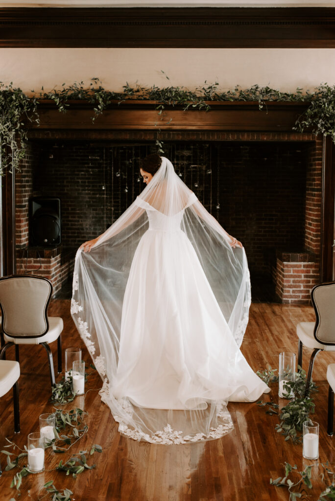Bride showing off her veil 