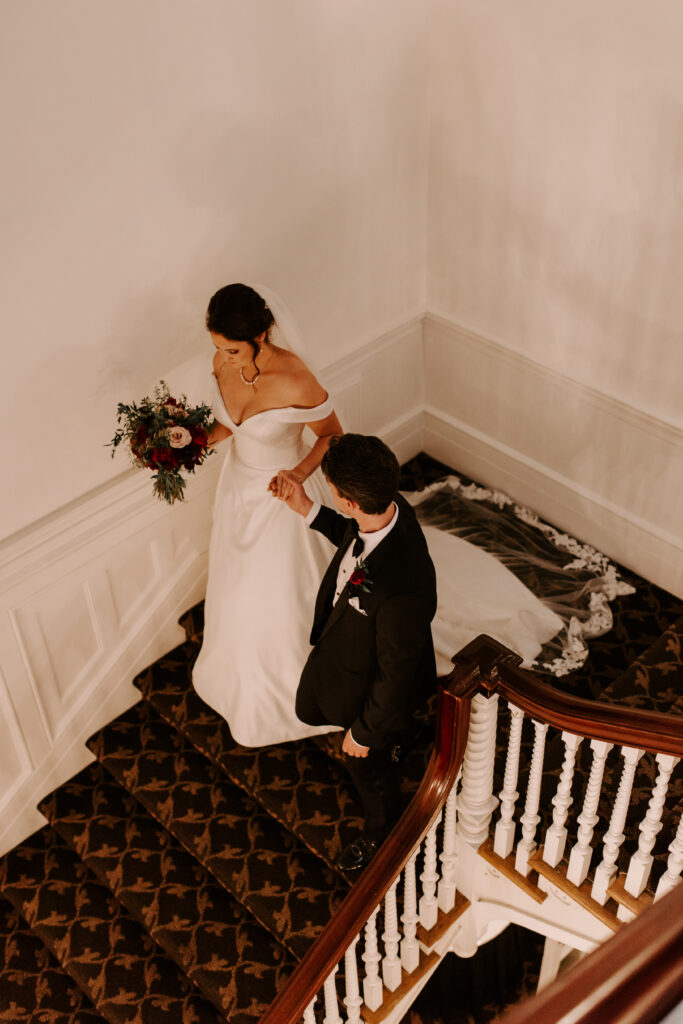 Bride and Groom walking down the stairs at Spokane Club
