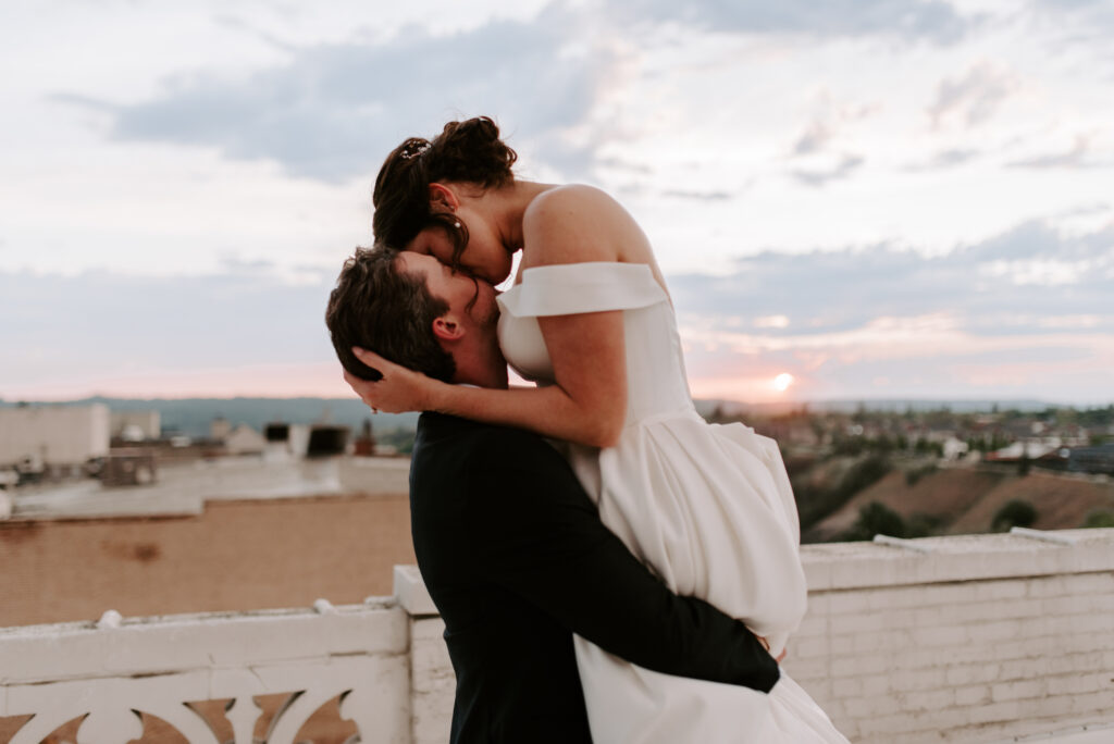 Bride and Groom during sunset on a rooftop on their wedding day
