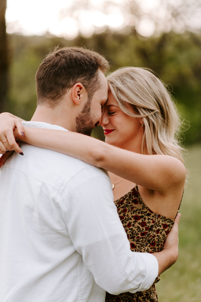 girl with arms wrapped around fiance's neck