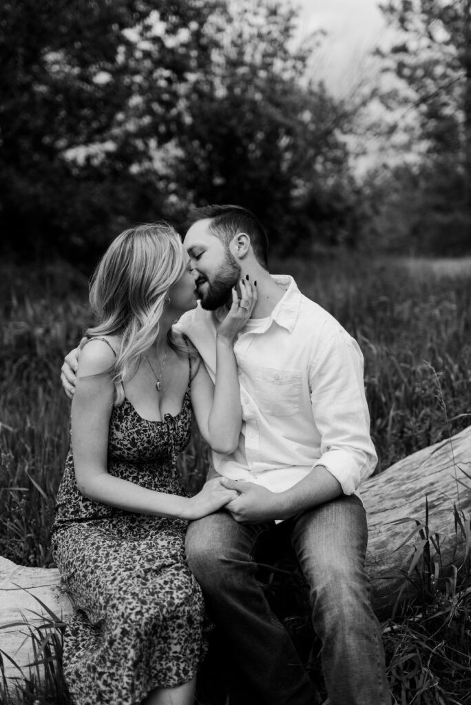 future bride and groom kissing