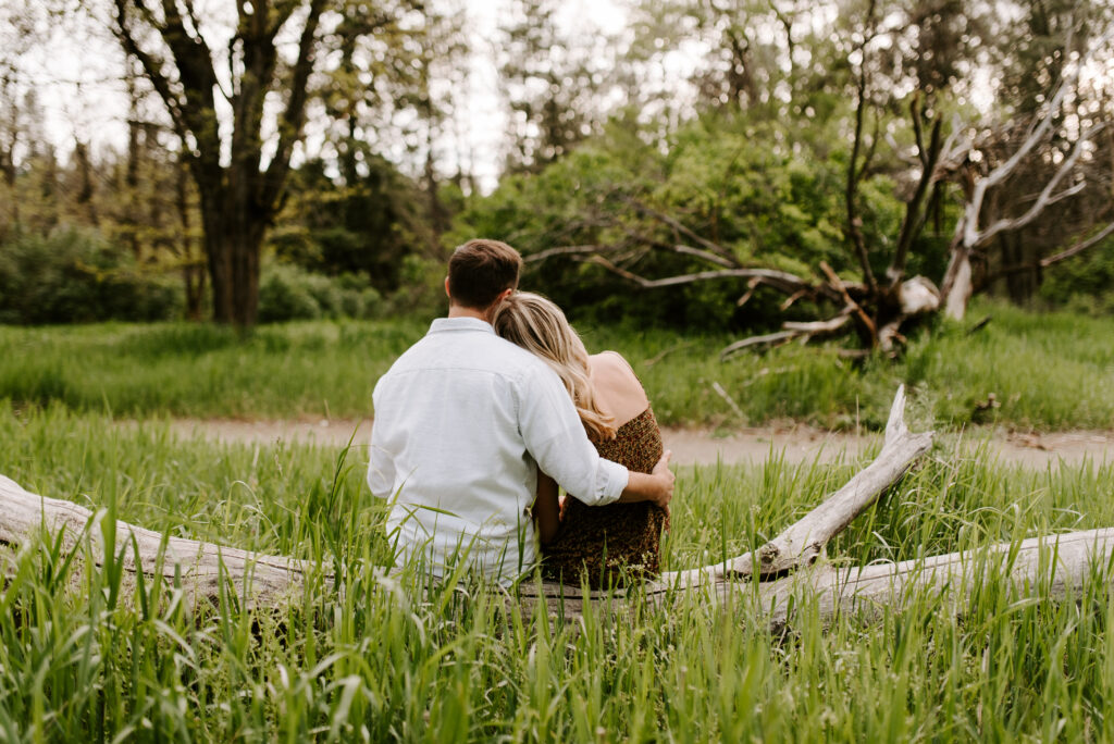 future bride and groom cuddling