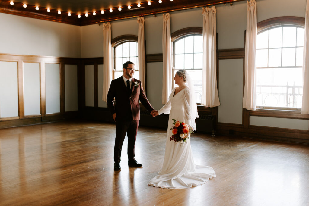 Bride and Groom standing in upstairs ballroom at Montvale Event Center