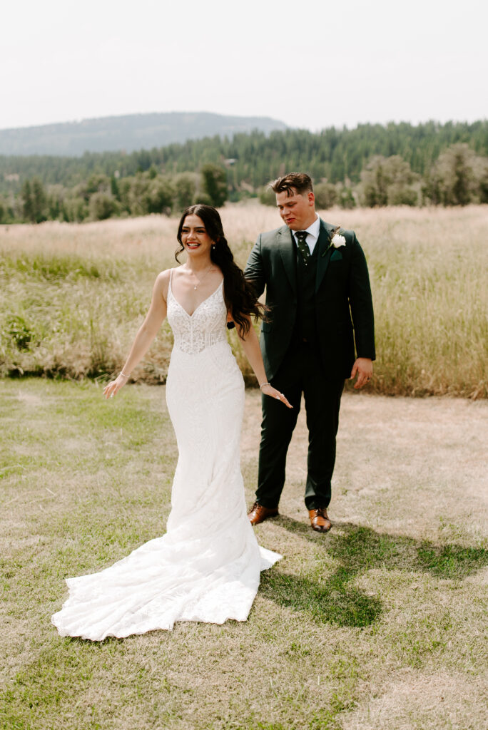 Karina turns around to show Tyler the back of her dress during their first look.