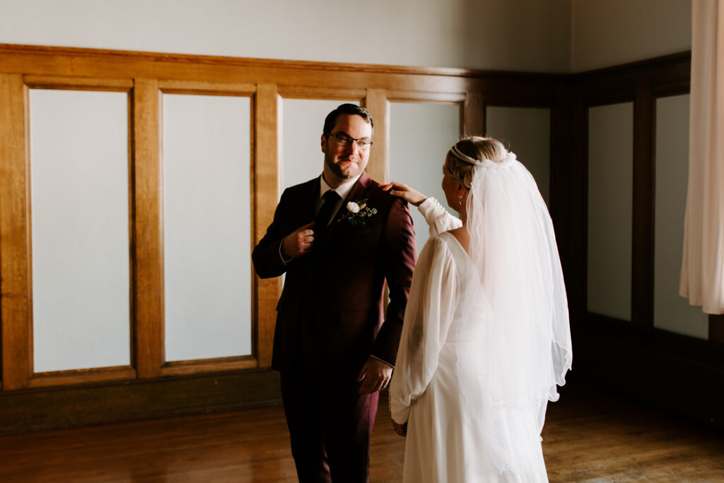 Taylor turns around to see his bride, Dyllin during their first look.