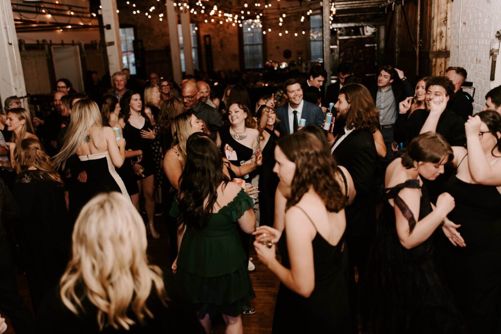 Wedding guests dancing during the reception.